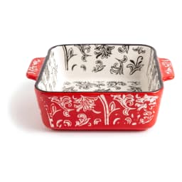 Rectangular granite oven dish with red exterior and white floral pattern, white interior with black floral design, on a whit… - view 2