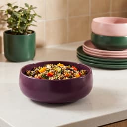 Single round deep plum ceramic serving bowl with a matte finish on a white background - view 1