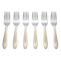 Single silver stainless steel dinner fork with gold accents on handle, next to a fruit plate on a beige counter. - view 3