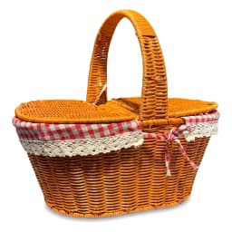 Brown woven picnic basket with red and white gingham lining, filled with grapes, cheese, bread, and a bottle, on a kitchen c… - view 3
