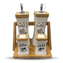 Set of four white porcelain oil and seasoning dispensers with wooden lids and a wooden tray, labeled in Arabic. - view 2