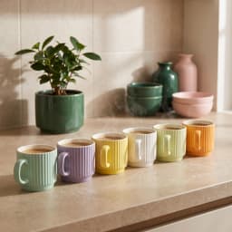 Six ribbed ceramic mugs in assorted pastel colors: light green, purple, yellow, cream, light green, and orange, on a white s… - view 1