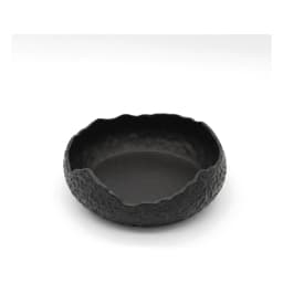 Single black porcelain serving bowl with a textured exterior and an irregular, wavy rim on a white background. - view 2