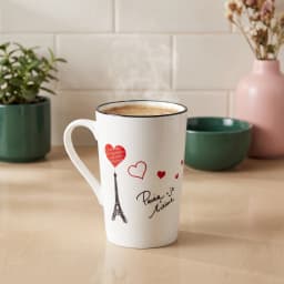 White ceramic mug with black rim, featuring a black Eiffel Tower, red hearts, and 'Paris je t'aime' text on a white backgrou… - view 1