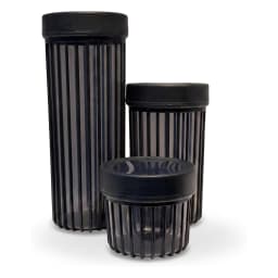 Set of three dark grey translucent acrylic storage jars with vertical ridges and opaque black lids on a white background. - view 3
