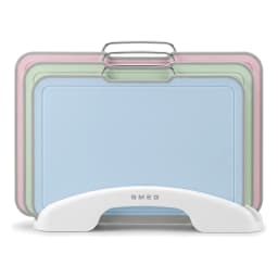 Three pastel plastic cutting boards (pink, green, blue) with grey edges, stored vertically in a white holder with metal hand… - view 2