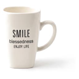 Single white ceramic mug with a slightly squared top and 'SMILE blessedness ENJOY LIFE' text, on a white shelf. - view 2