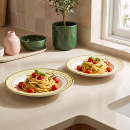 White porcelain pasta plate with green rim, yellow geometric border, olive branch, tomatoes, and 'love your PASTA' text. - view 1