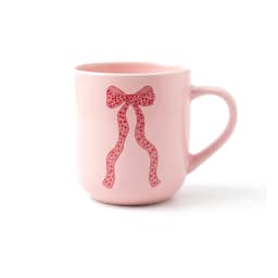 Light pink ceramic mug with a red polka-dotted ribbon design on a white background - view 2