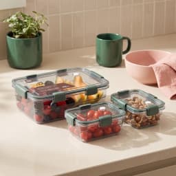 Three rectangular clear plastic food storage containers with dark green lids and locking clips on a white background. - view 1
