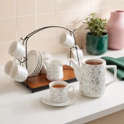 White porcelain tea set with grey and gold geometric pattern, including 6 cups, 6 saucers, teapot, sugar pot, milk jug, on a… - view 1