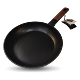 Black granite frying pan with a dark wooden handle, cooking cherry tomatoes and mushrooms with steam rising, on a white kitc… - view 2