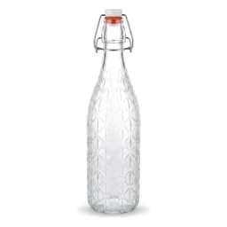 Clear glass bottle with diamond pattern texture, white swing top stopper, and orange rubber seal on a white shelf. - view 2