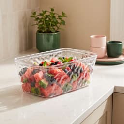 Clear rectangular acrylic storage container with textured sides on a white background - view 1