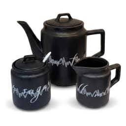 Complete 17-piece black ceramic coffee and tea set on a dark wooden tray with a black metal stand, white background. - view 3