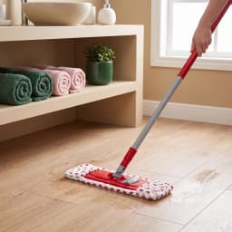 Red and white 40cm microfiber flat mop with a grey handle, shown in its packaging on a white background. - view 1