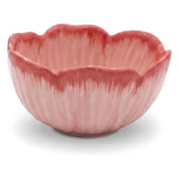 Pink porcelain bowl with a fluted flower petal design, filled with colorful fruit salad, on a light kitchen counter. - view 2