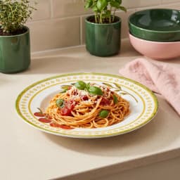 White porcelain pasta plate with green rim, yellow geometric border, olive branch, tomatoes, and 'love your PASTA' text. - view 3