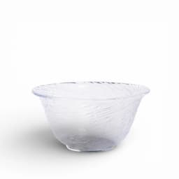 Clear glass bowl with a textured, wavy surface and a slightly flared rim, casting a soft shadow on a white background. - view 2