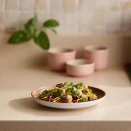 Single round ceramic plate with a white exterior and a brown wood grain patterned interior, on a white background. - view 1
