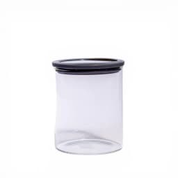 Clear cylindrical glass storage jar with a dark grey plastic lid and a visible seal, on a white background. - view 2