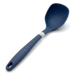 Single dark blue silicone ladle with a ribbed handle and hanging hole, standing upright on a white shelf. - view 2