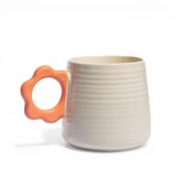 Cream ceramic mug with horizontal ridges and a bright yellow flower-shaped handle on a white background. - view 3